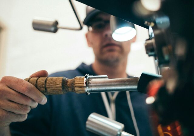Photo by Battlecreek Coffee Roasters - Find Local Businesses Near Me, Addresses, and Reviews | Nearme.Help man wearing black pullover hoodie holding tool